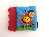 Babybuch aus Stoff mit Rassel - Ravensburger, 3-12 Monate